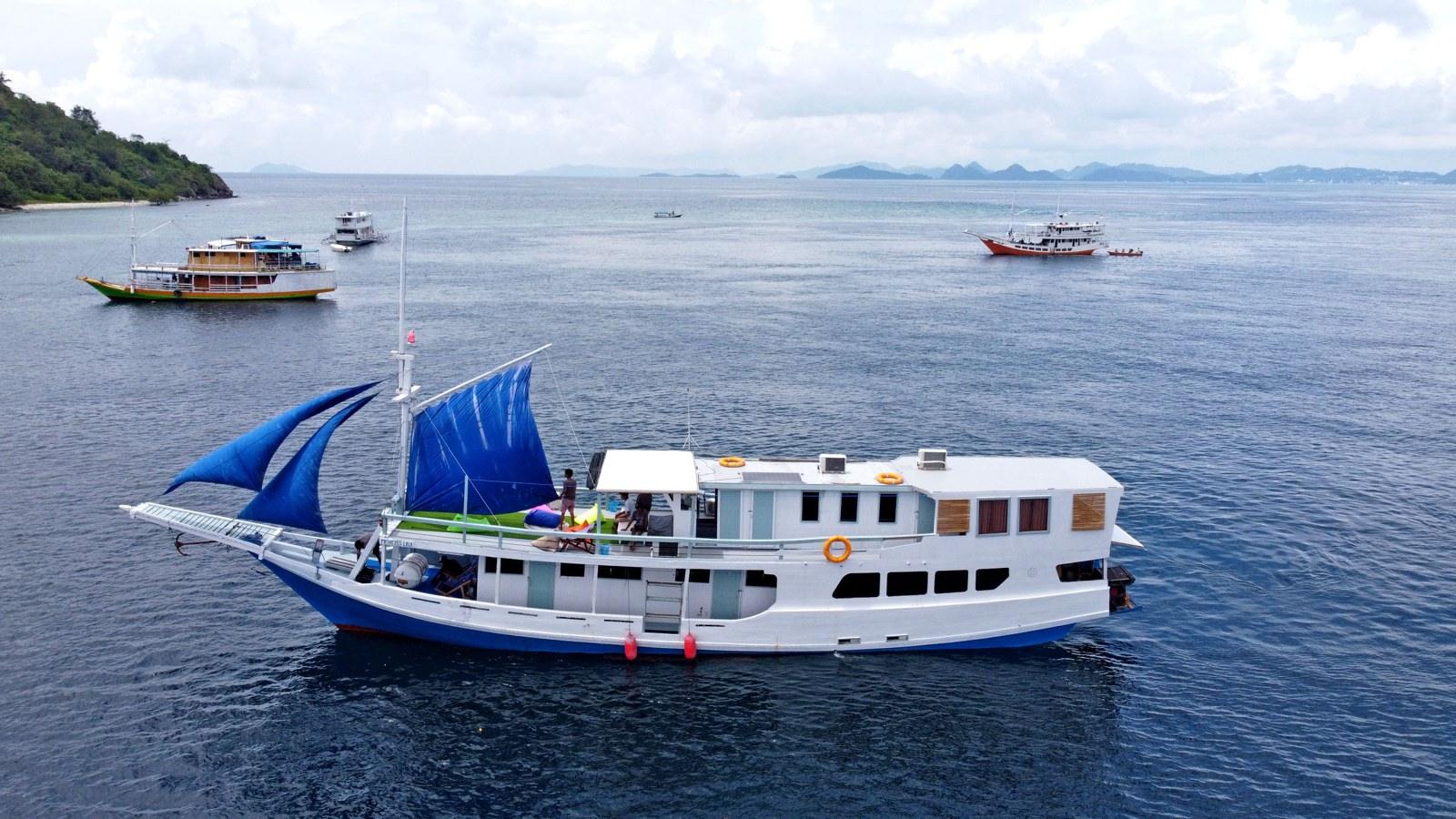 Princess Lala in profile, sails set, off Labuan Bajo